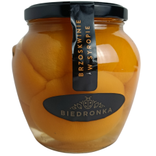 Консервовані половинки персиків Brzoskwiniw w syropie Biedronka 560g