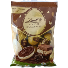 Шоколадні яйця з нугою в білому шоколаді з краплями темного  Nougat Kaa0-Nibs Lindt 90g