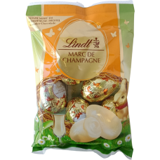 Шоколадні яйця з смаком шампанського-трюфеля в білому шоколаді Marc De Champagne Lindt 90g