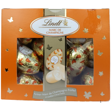 Шоколадні яєчка у білому шоколаді Marc de Champagne  Lindt 450g